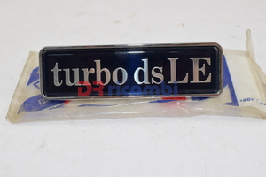 [82486093] SIGLA MODELLO &quot; TURBO DS LE &quot; GRIGLIA RADIATORE LANCIA THEMA TD  LANCIA 82486093